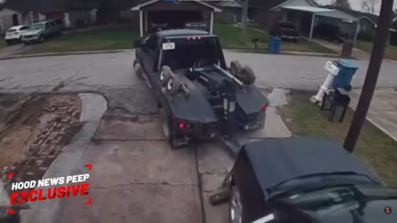 Tow truck tries to steal a car from its own driveway.
