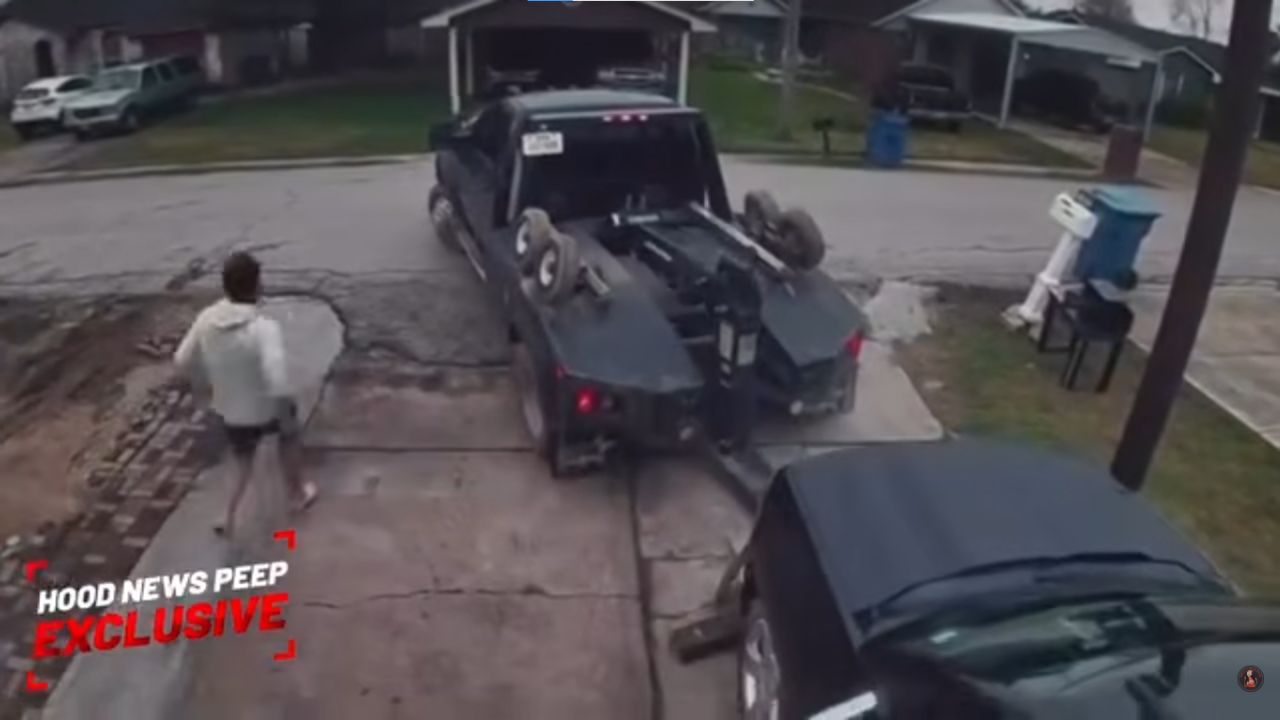 Tow truck tries to steal a car from its own driveway.