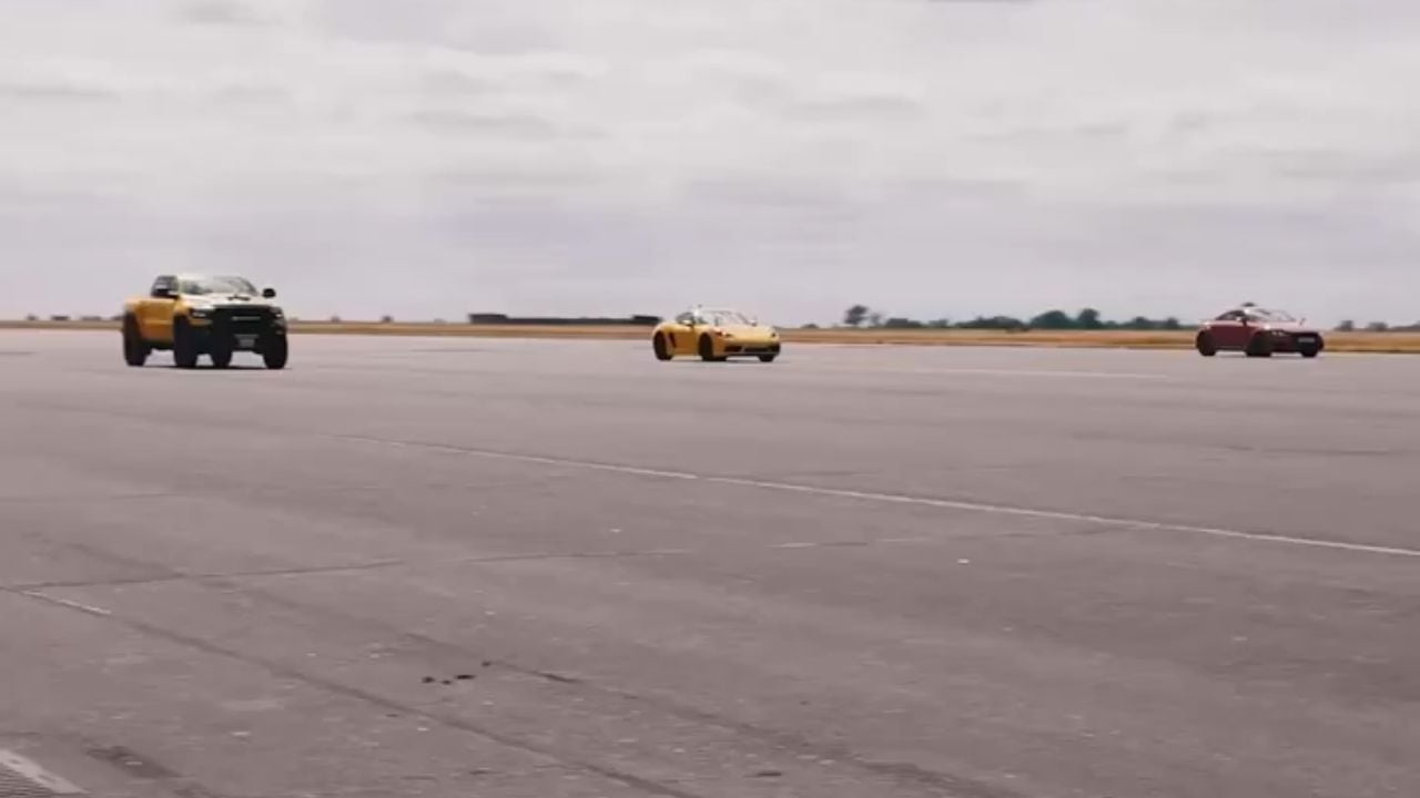 Hennessey Mammoth 1000 TRX racing a Porsche 911 and Nissan sports car.