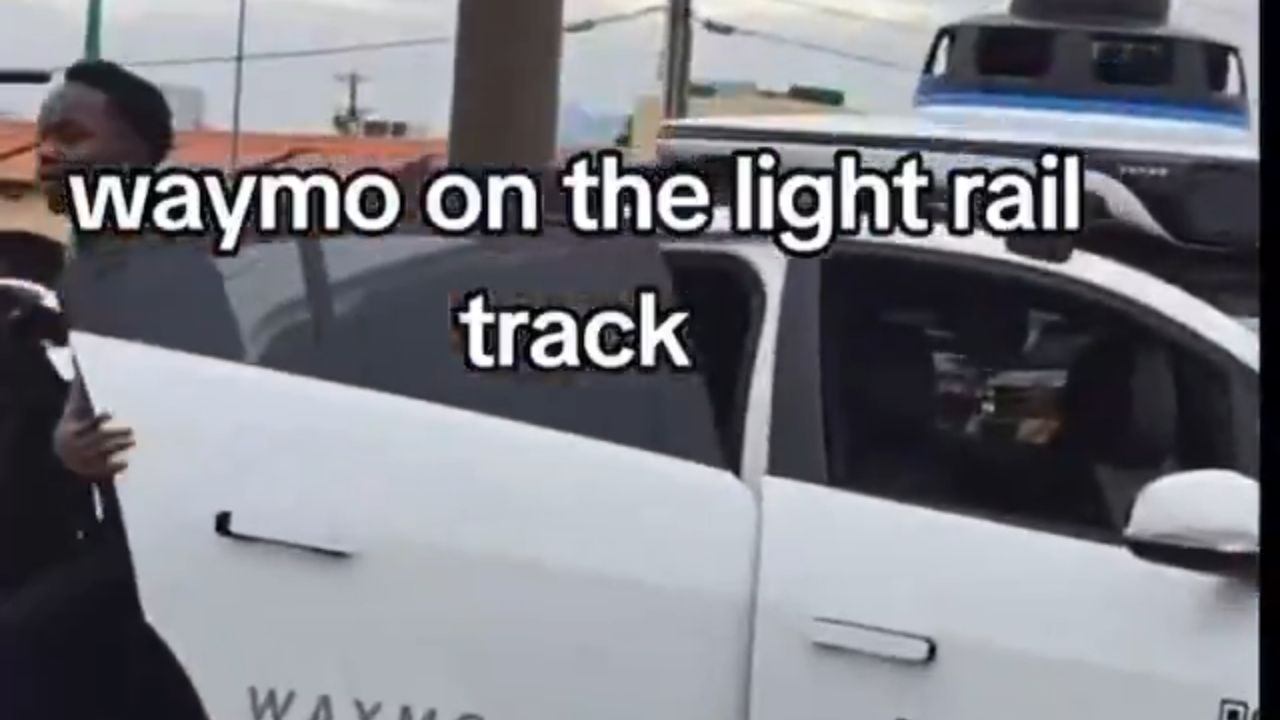 Waymo robotaxi stuck on rail tracks.