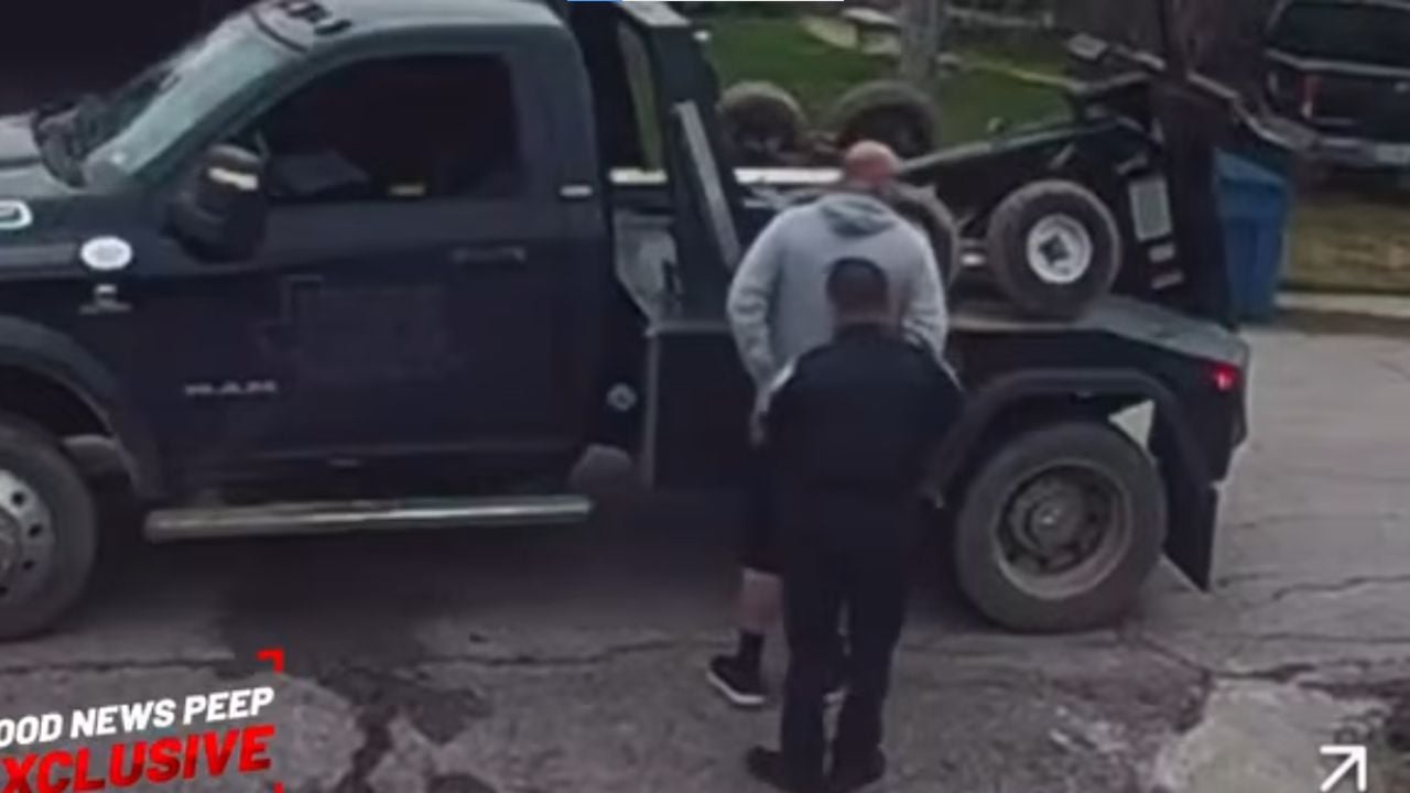 Tow truck tries to steal a car from its own driveway.