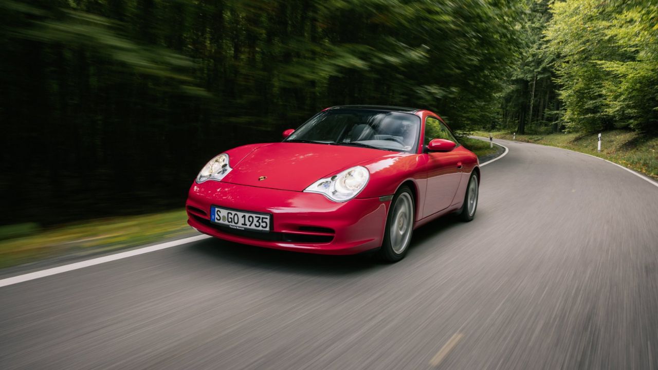 Red Porsche 911 (996) Front 3/4 view driving