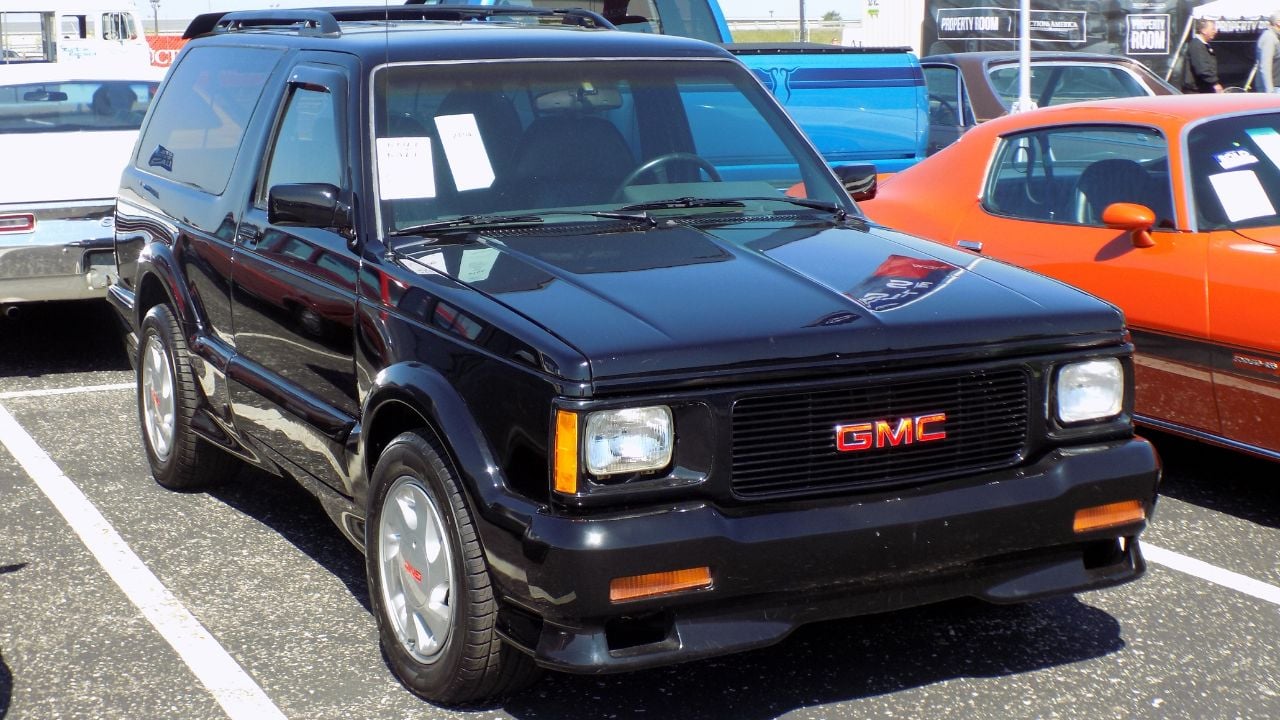 Black 1993 GMC Typhoon front 3/4 view in a parking lot