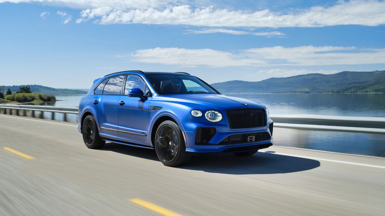 Blue 2026 Bentley Bentayga Speed Front 3/4 view driving