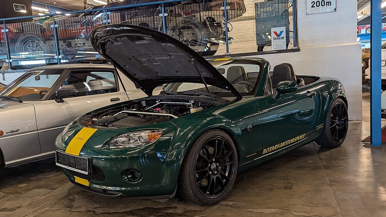 Mazda Miata with popped hood and Wankel motor.