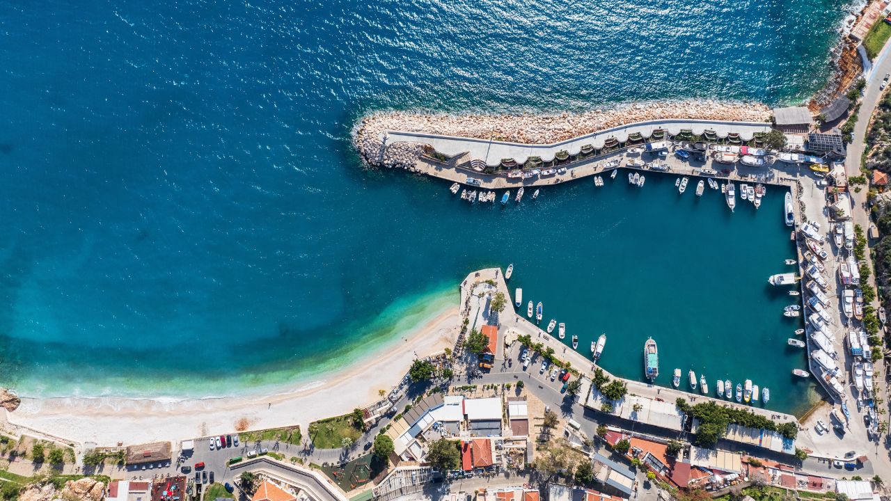 Overhead shot of Kalkan Marina with boats docked in clear blue waters