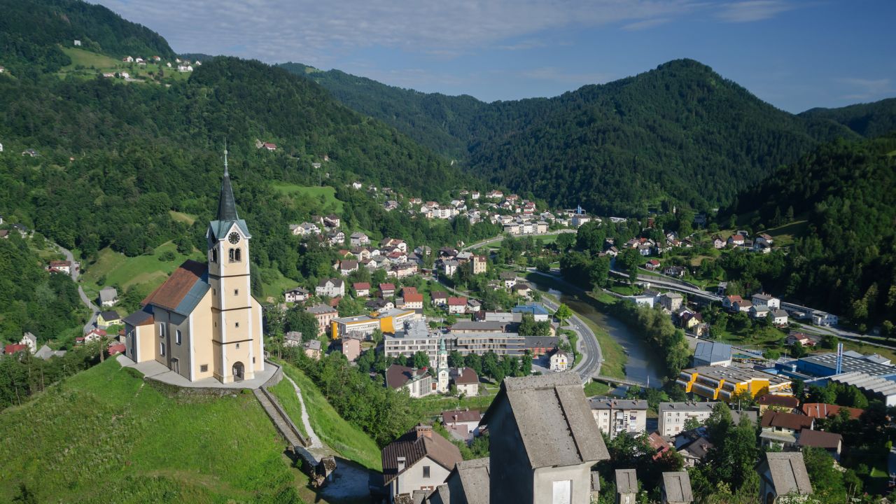Panorama of the Idrija town with sv. Anton church and Idrija river, Slovenia