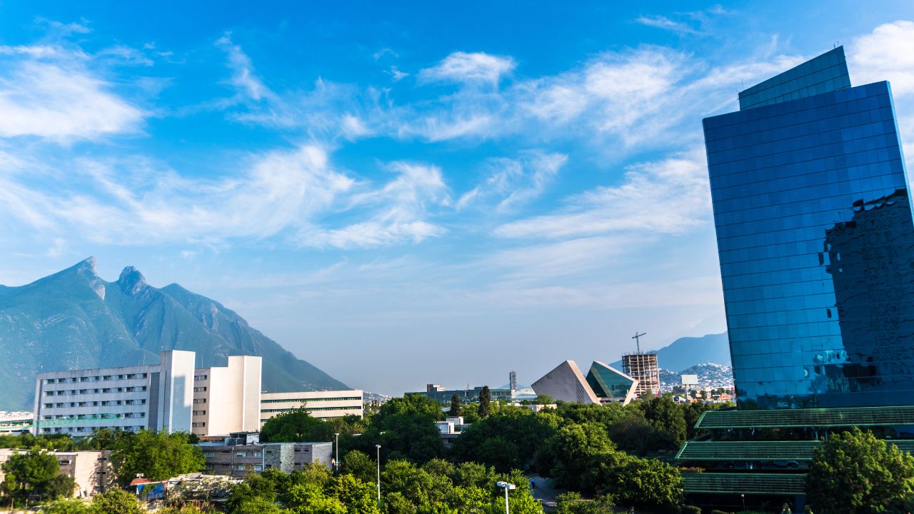 Monterrey city in mexico, urban shots of the city during the day, showing the modern buildings and amazing mountains in the back, cloudy day