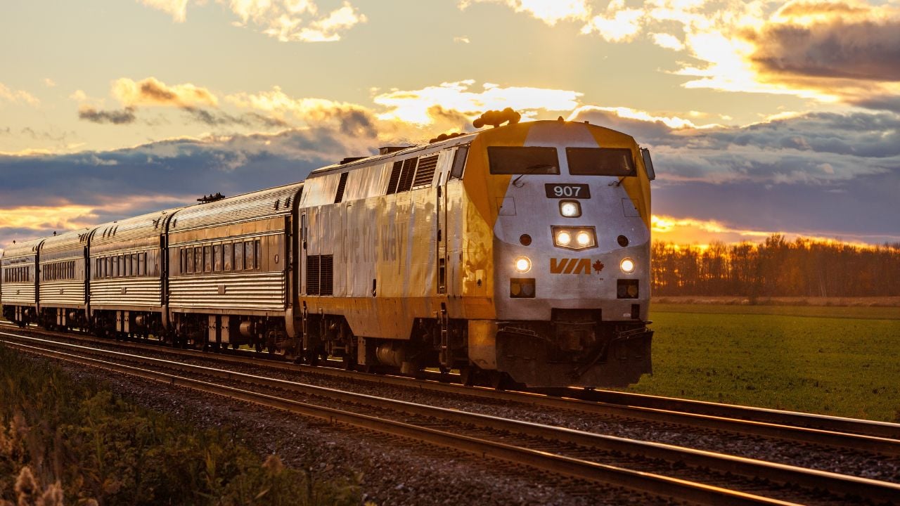 Les Cedres, Canada – November 1 2021: A VIA Rail train travels eastbound to Montreal during sunset