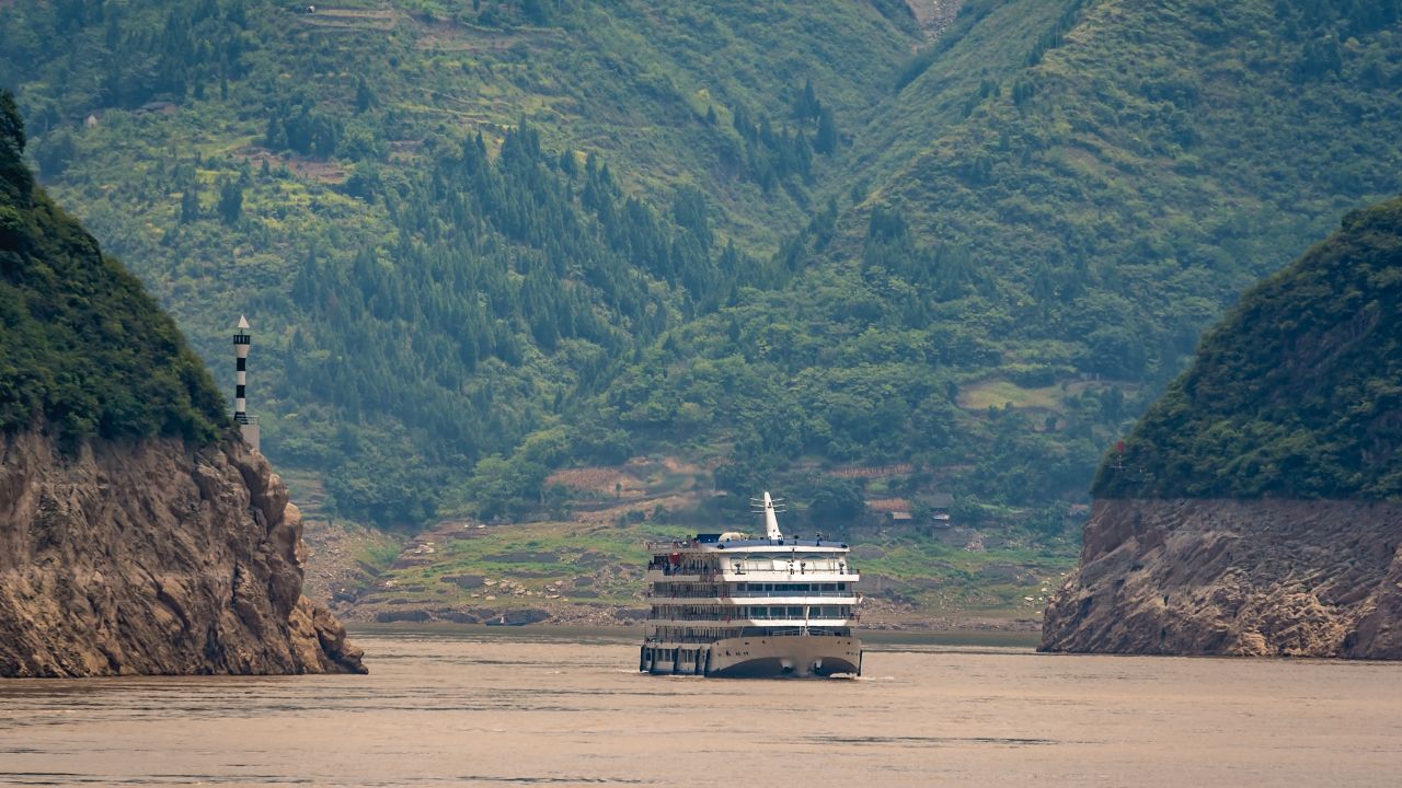 Luxury passenger cruise ship sailing through the gorge on the magnificent Yangtze River, China