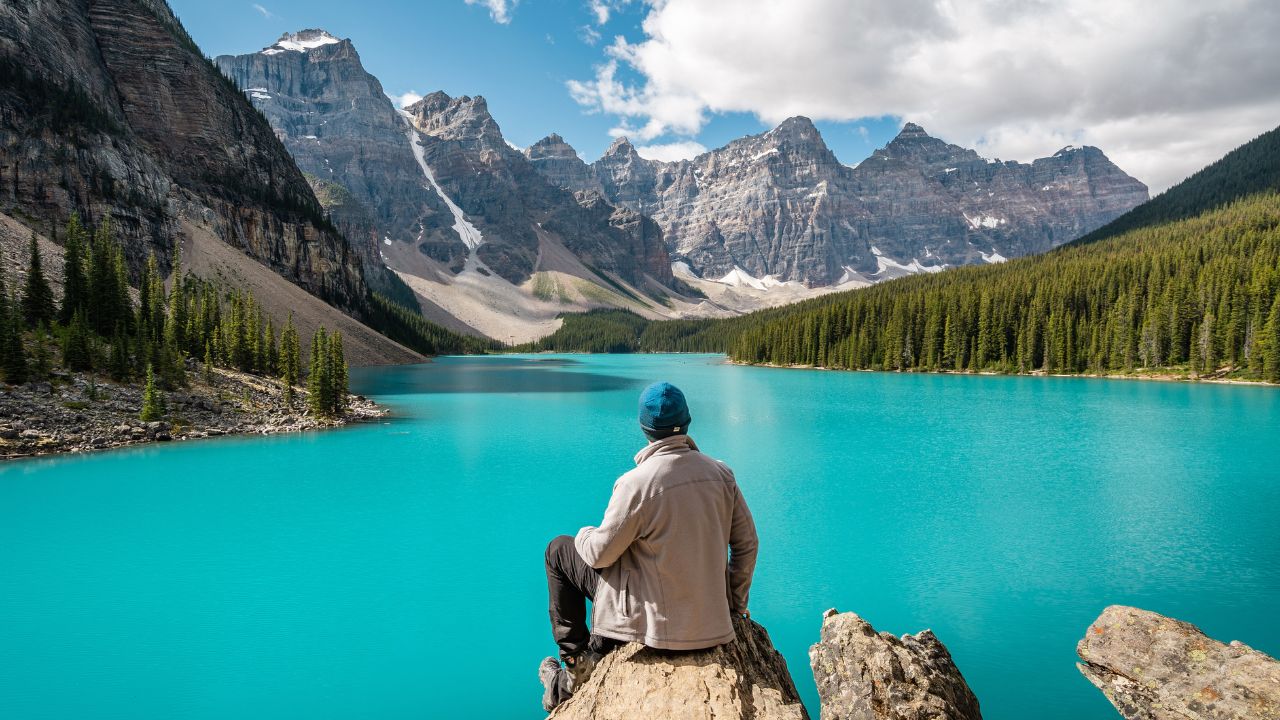 Hiker at Moraine Lake during summer in Banff National Park, Alberta, Canada.