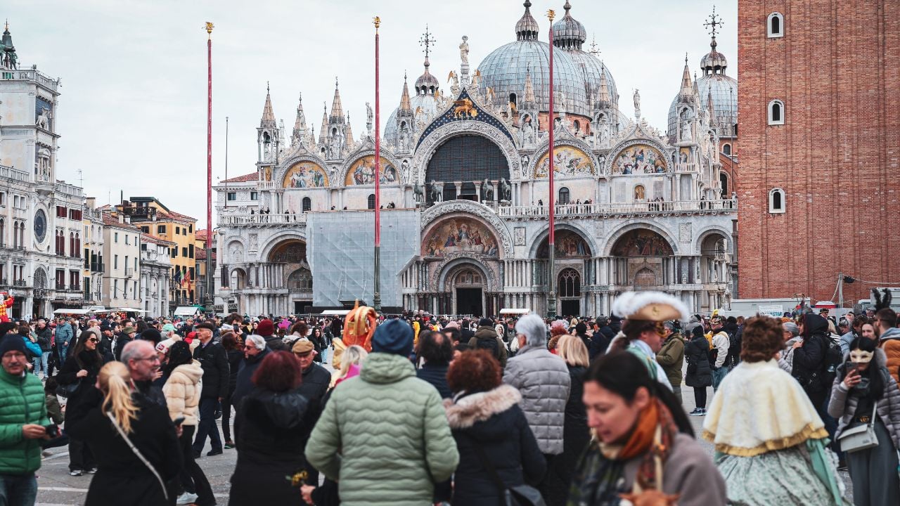 Venice, Italy - March 01, 2025: Venice carnival draws crowds with stunning architecture and vibrant costumes