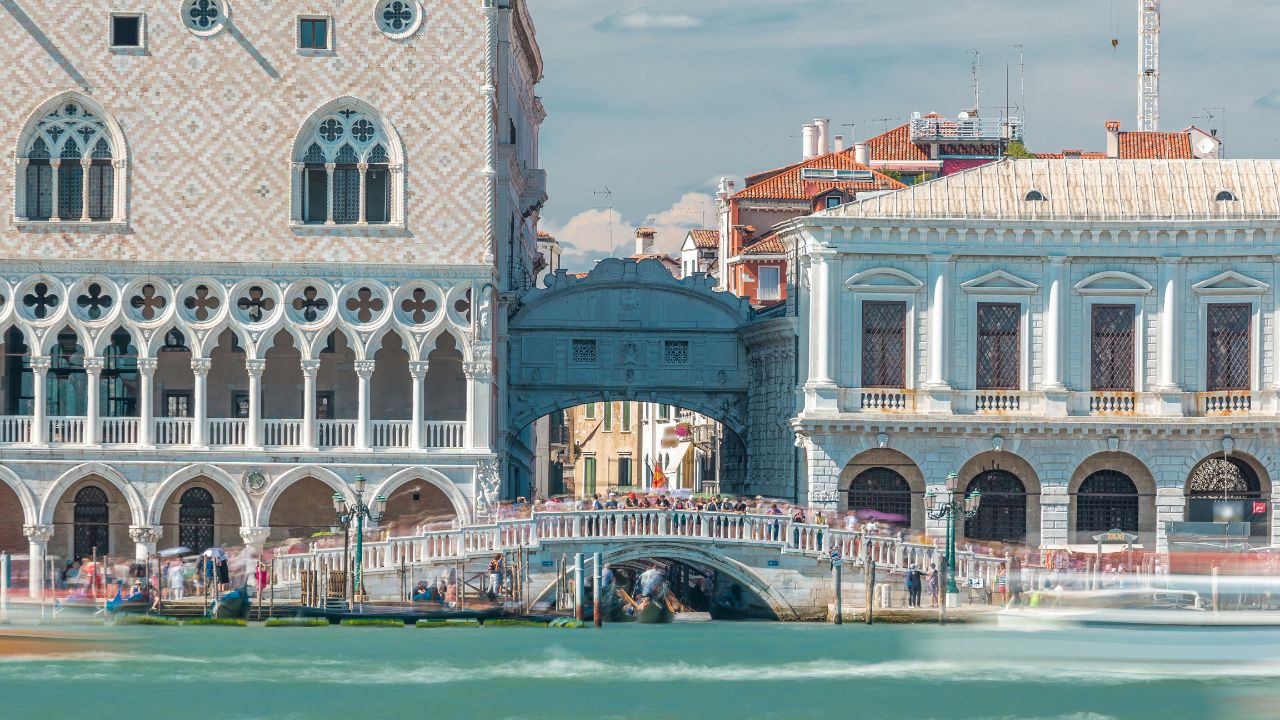 Sea view to stone bridge Ponte della Paglia from San Giorgio Maggiore timelapse. The bridge is always surrounded by tourists, with the best view of the Bridge of Sighs