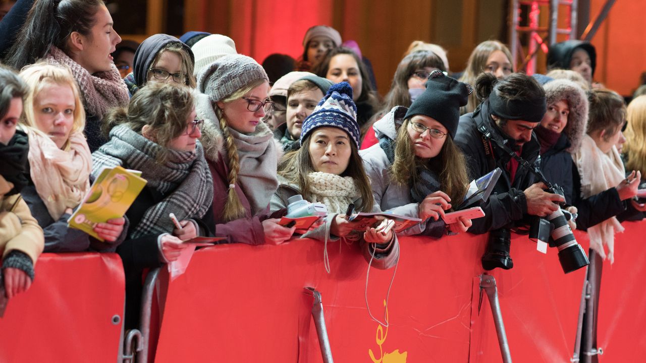 Berlin, Germany - February 23, 2018: Fans waiting on red carpet for autographs before the documentary film 'Songwriter' premiere at 68th Berlinale International Film Festival Berlin 2018