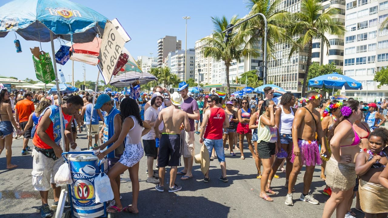 RIO DE JANEIRO - FEBRUARY 19, 2017: Crowds of young people and vendors gather at a morning street party in Copacabana during the city's carnival celebrations.