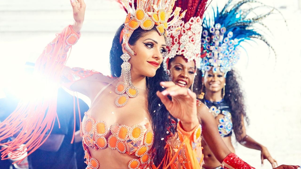 Carnival, brazil and festival with a woman group in costume ready for a new year celebration event. Dance, party and tradition with female friends or dancers wearing cultural outfit in rio de janeiro