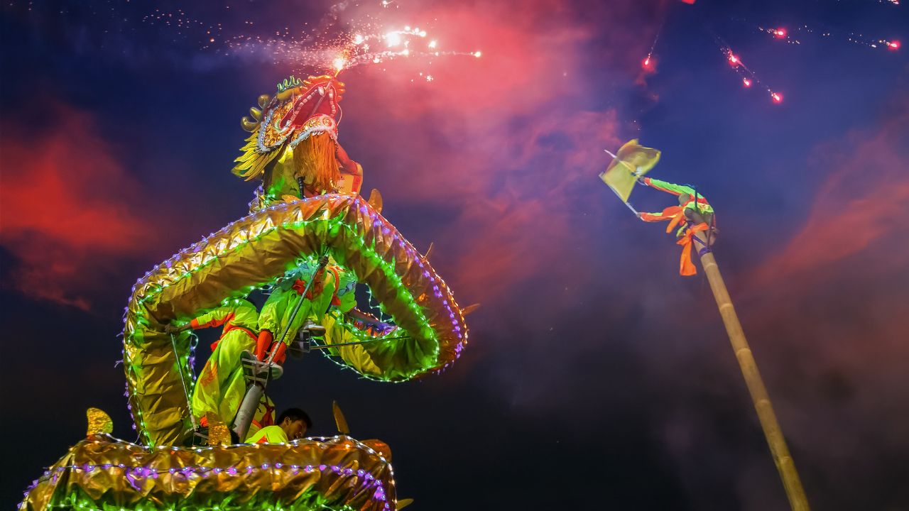 BANGKOK, THAILAND - FEBRUARY 20 2016: Unidentified group of people perform a traditional dragon dance at Rama IX public park to celebrate traditional Chinese's lunar new year