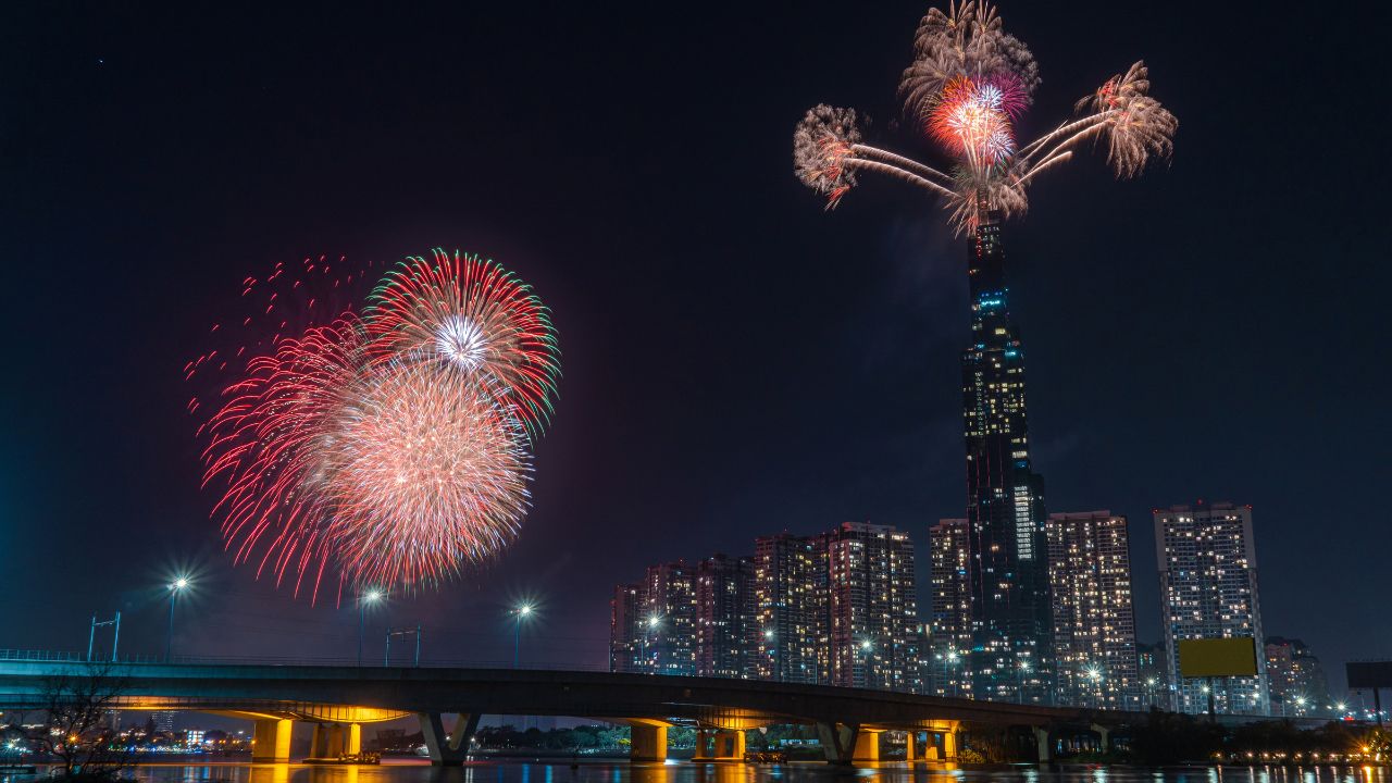Multiple Colorful fireworks at Ho Chi Minh City celebrating Happy New Year 2020 moments. View from Sai Gon riverside