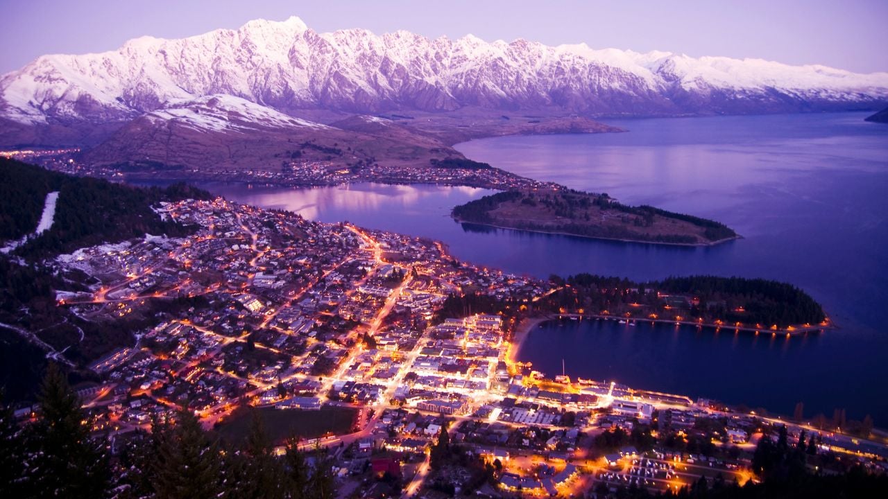 Aerial view of Queenstown with city lights in New Zealand.