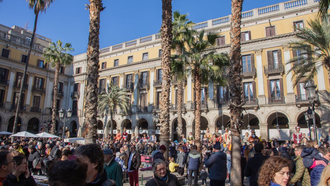 People walking through Barcelona’s Gothic Quarter, Spain