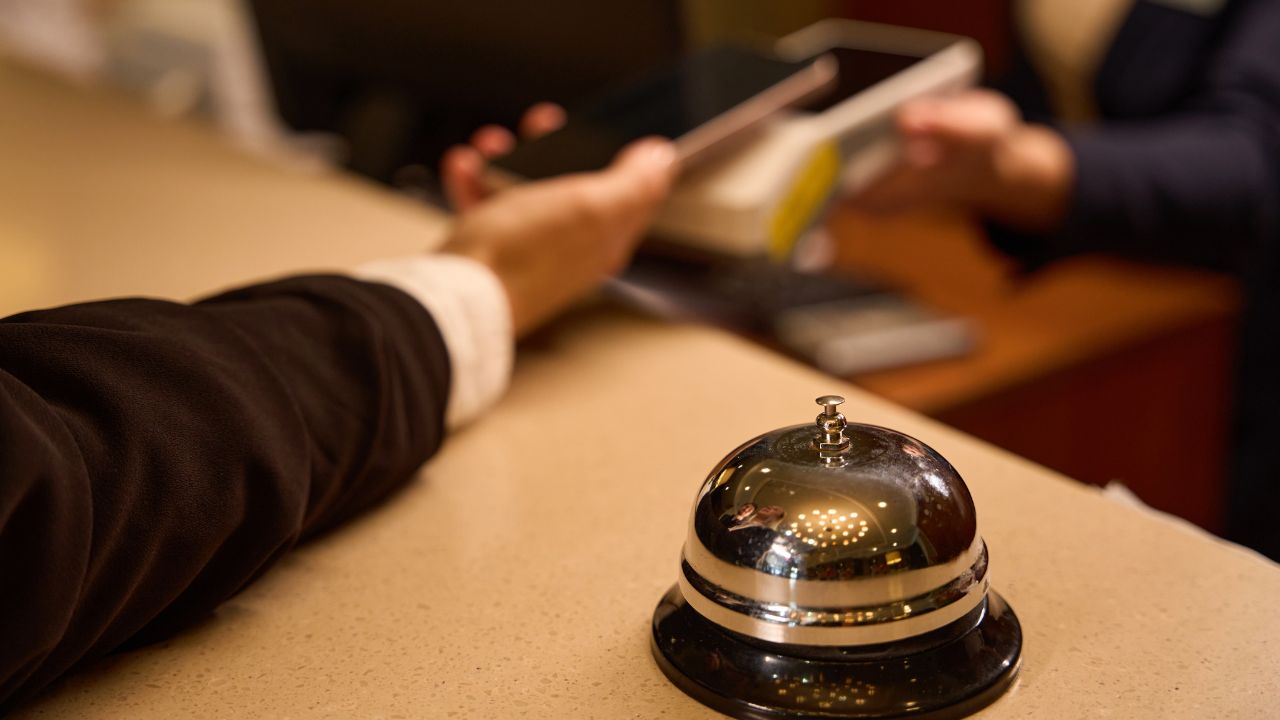 Close up photo of reception bell on desk