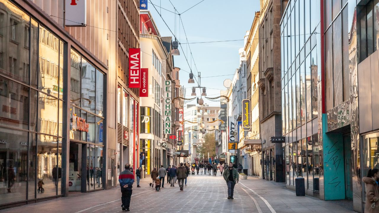 COLOGNE, GERMANY - NOVEMBER 6, 2022: Panorama of the Westenhellweg, busys with shopss and stores. Westenhellweg is a shopping street, high street of Dortmund altstadt, Old Town.