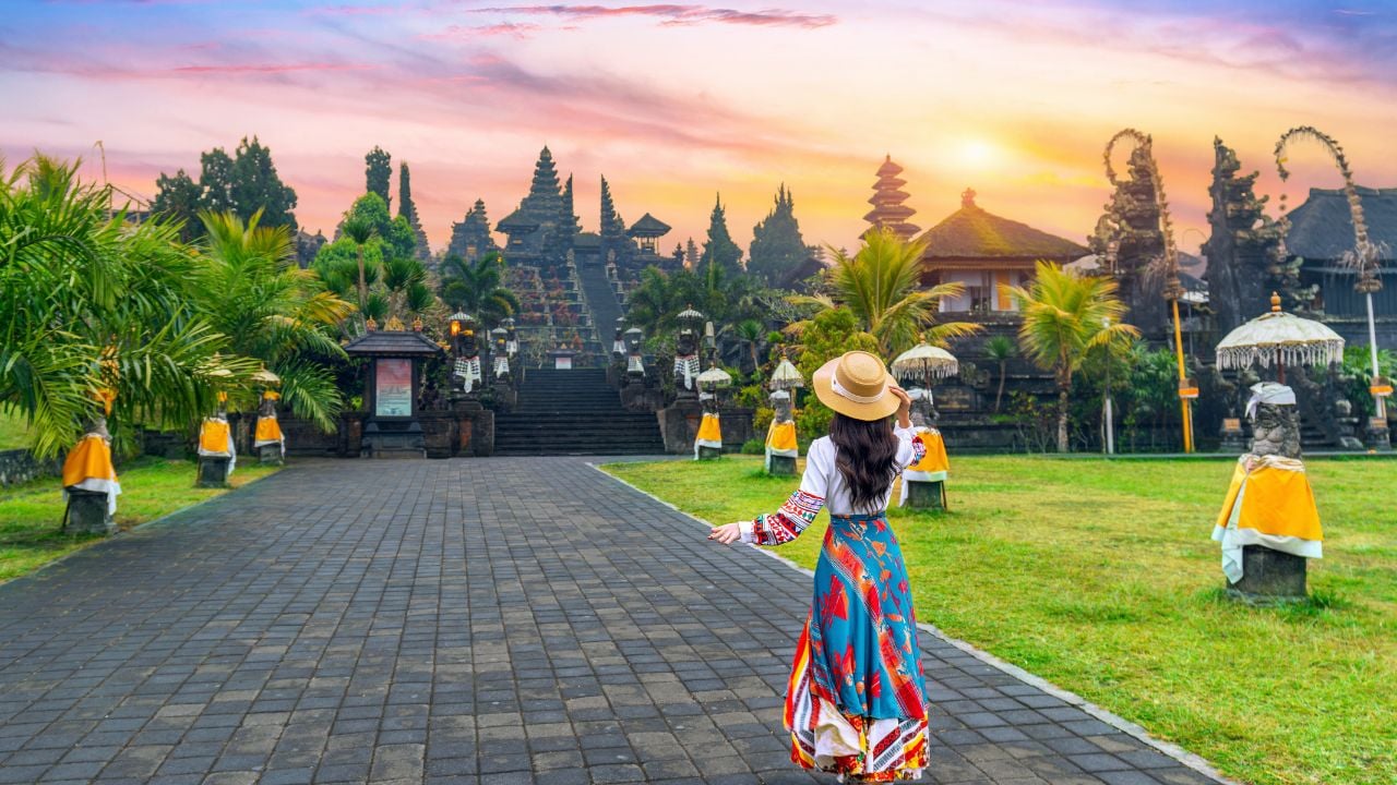 Women tourists walking at Besakih temple in Bali, Indonesia.