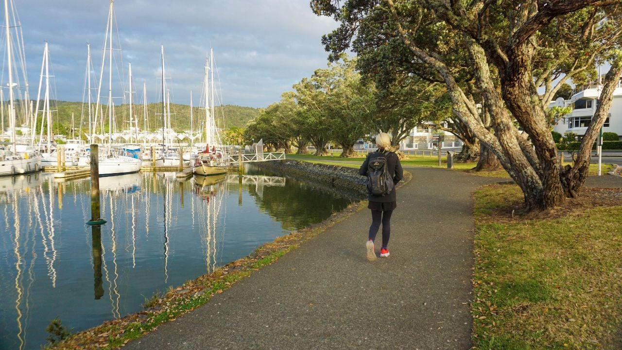 Whangarei, New Zealand - November 16, 2024 : A woman walking around Riverside Park in Whangarei, New Zealand on sunny morning with beautiful views.