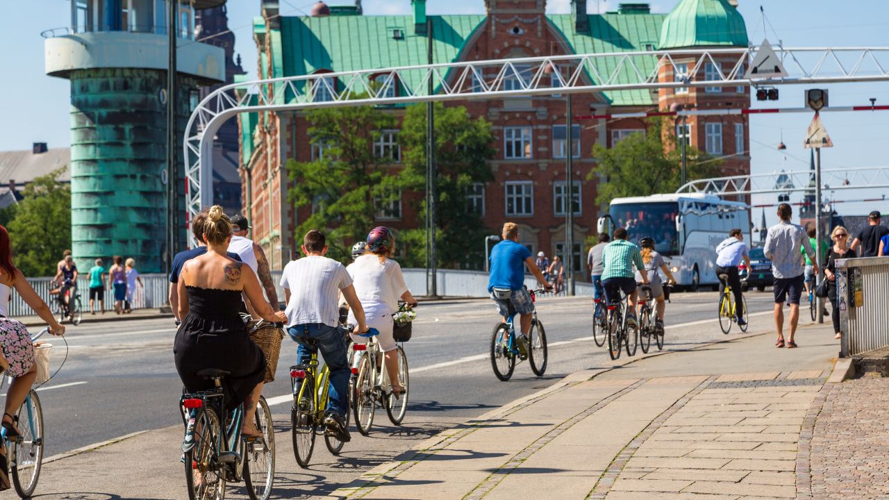 COPENHAGEN, DENMARK - JULY 25: Copenhagen is one of the most bicycle friendly cities in the World. Many people biking in centre of city in Copenhagen, Denmark July 25, 2014