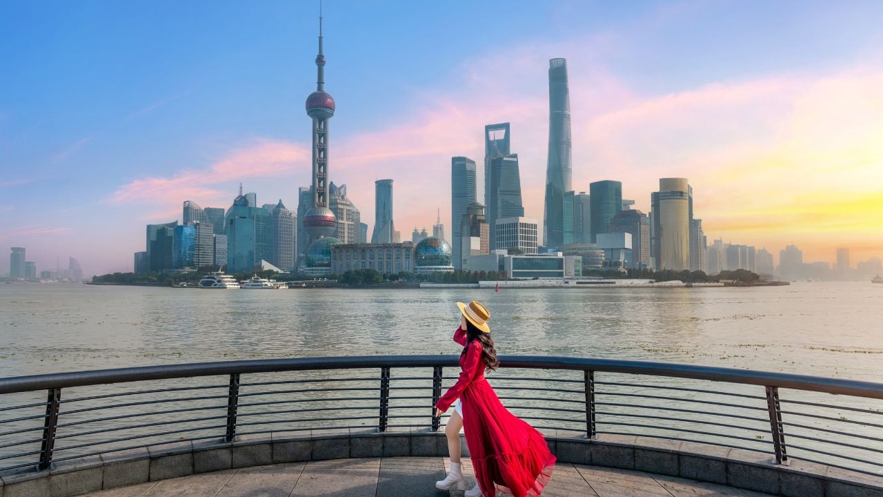 Tourists sightseeing on The Bund and Lujiazui of Shanghai, China.