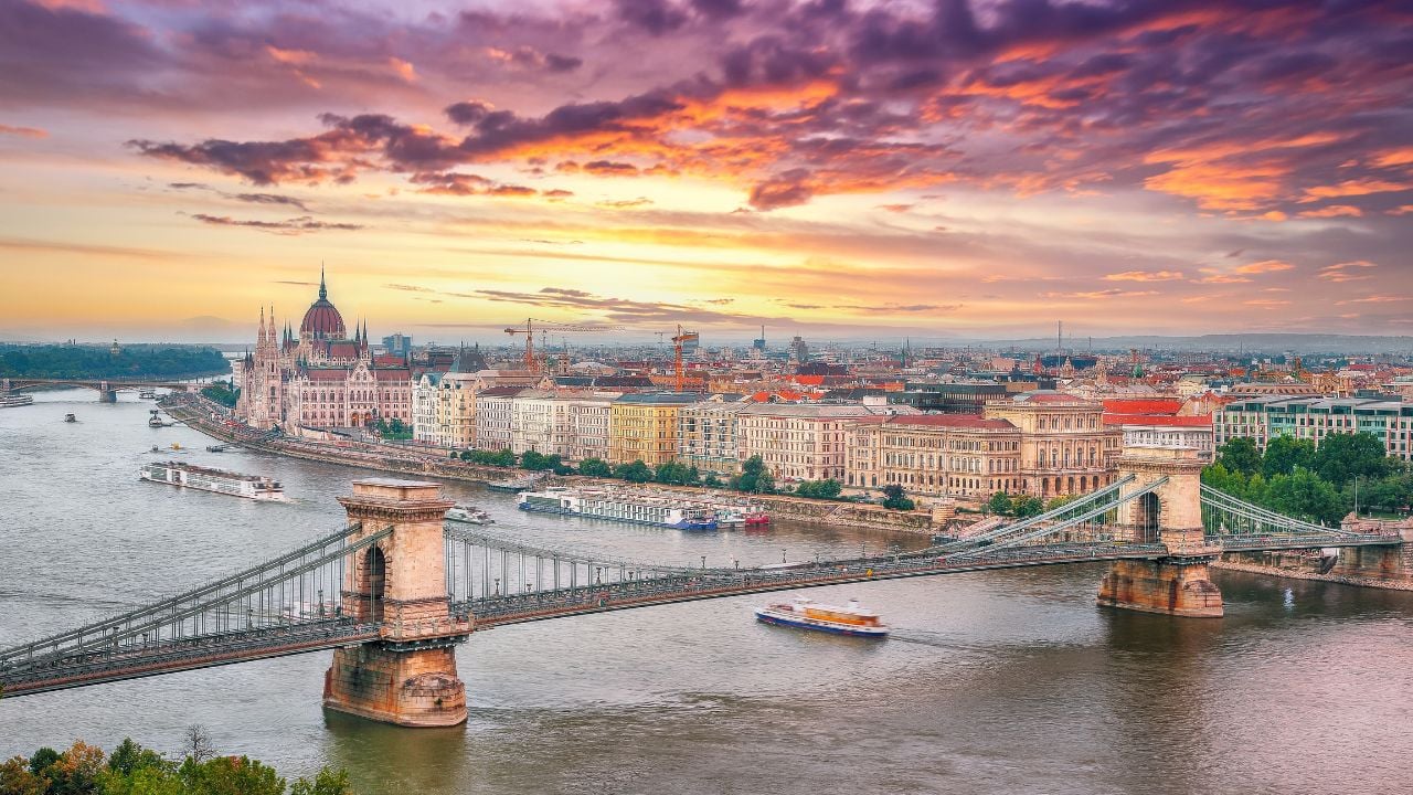 Budapest city evening scene. View at Chain bridge, river Danube and famous building of Parliament. Location: Budapest, Hungary, Europe.