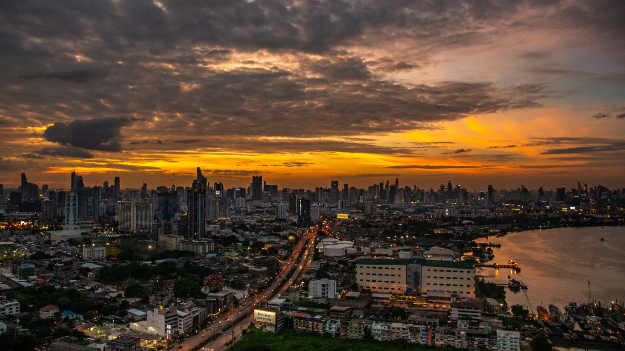 Bangkok skyline along the Chao Phraya River at twilight