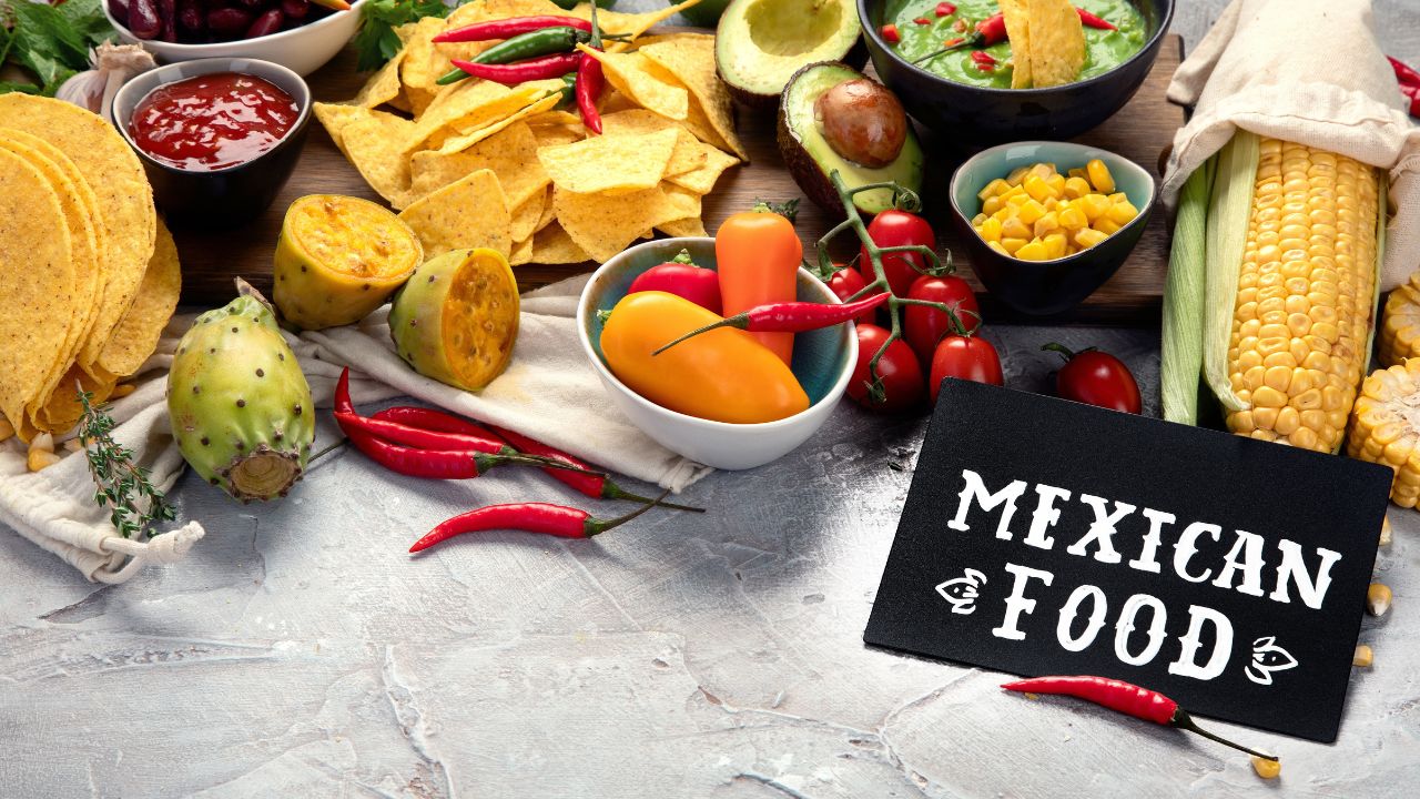 Mexican dishes and snacks assortment on light gray background. Cuisines of the world concept.