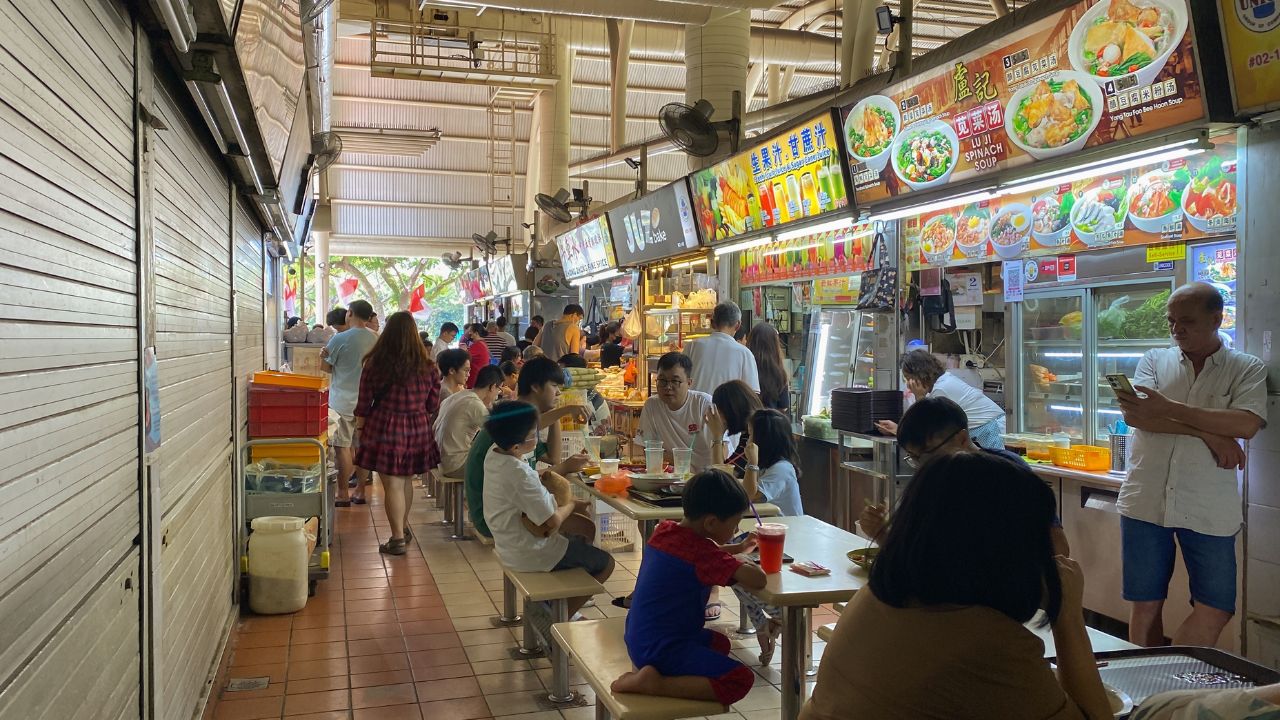 Singapore 2024 Sep01 - Customers dining at Bukit Timah Market and Food Centre, in front of food stalls. Hawker centre is scheduled for demolition, some stalls will be moving to nearby interim location