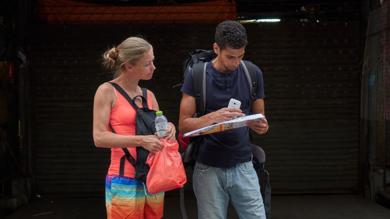 Bangkok,Thailand,Feb 3 2018,Young couple tourism looking at map,at Chatuchak Weekend Market or JJ market
