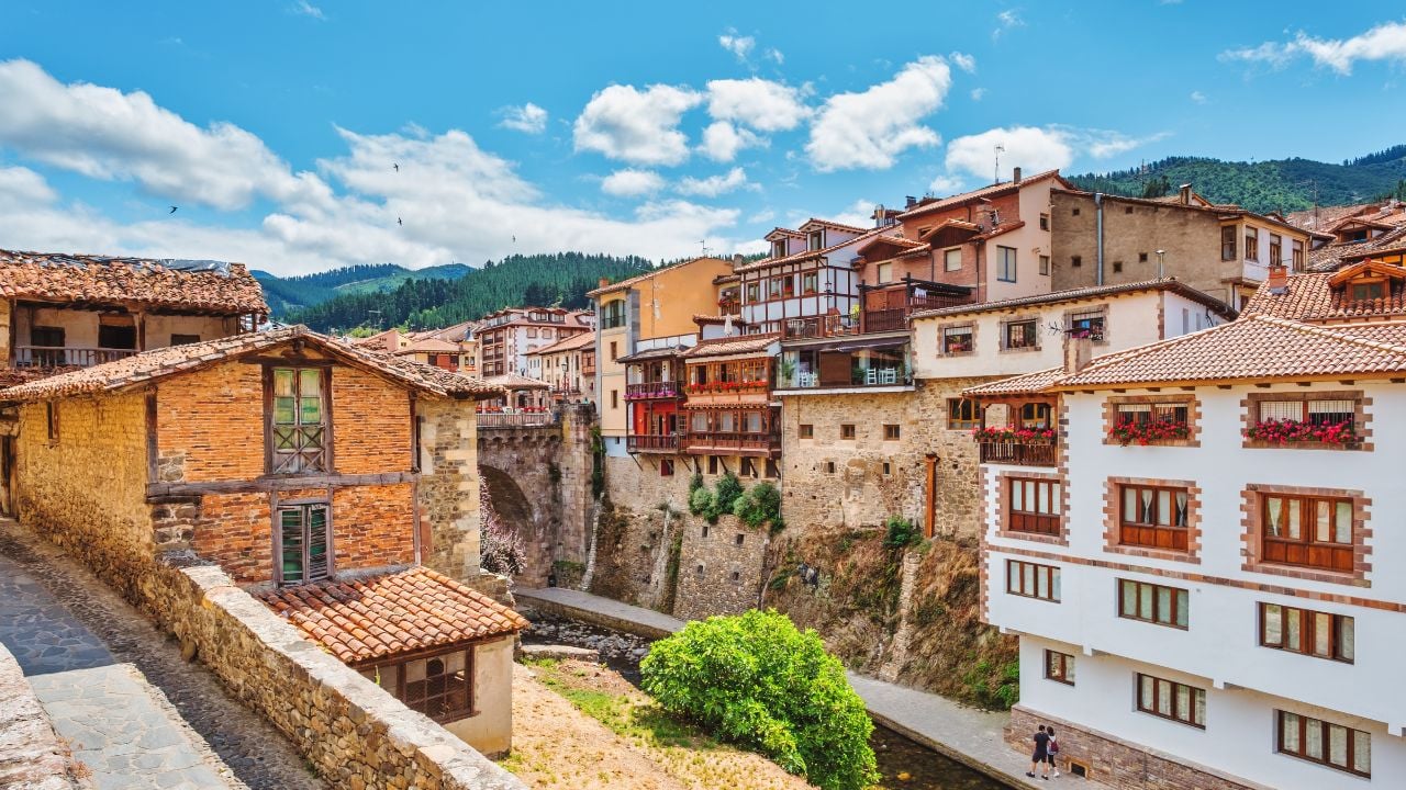 Views of the medieval village of Potes with hanging houses and Deva river, Cantabria, Spain.