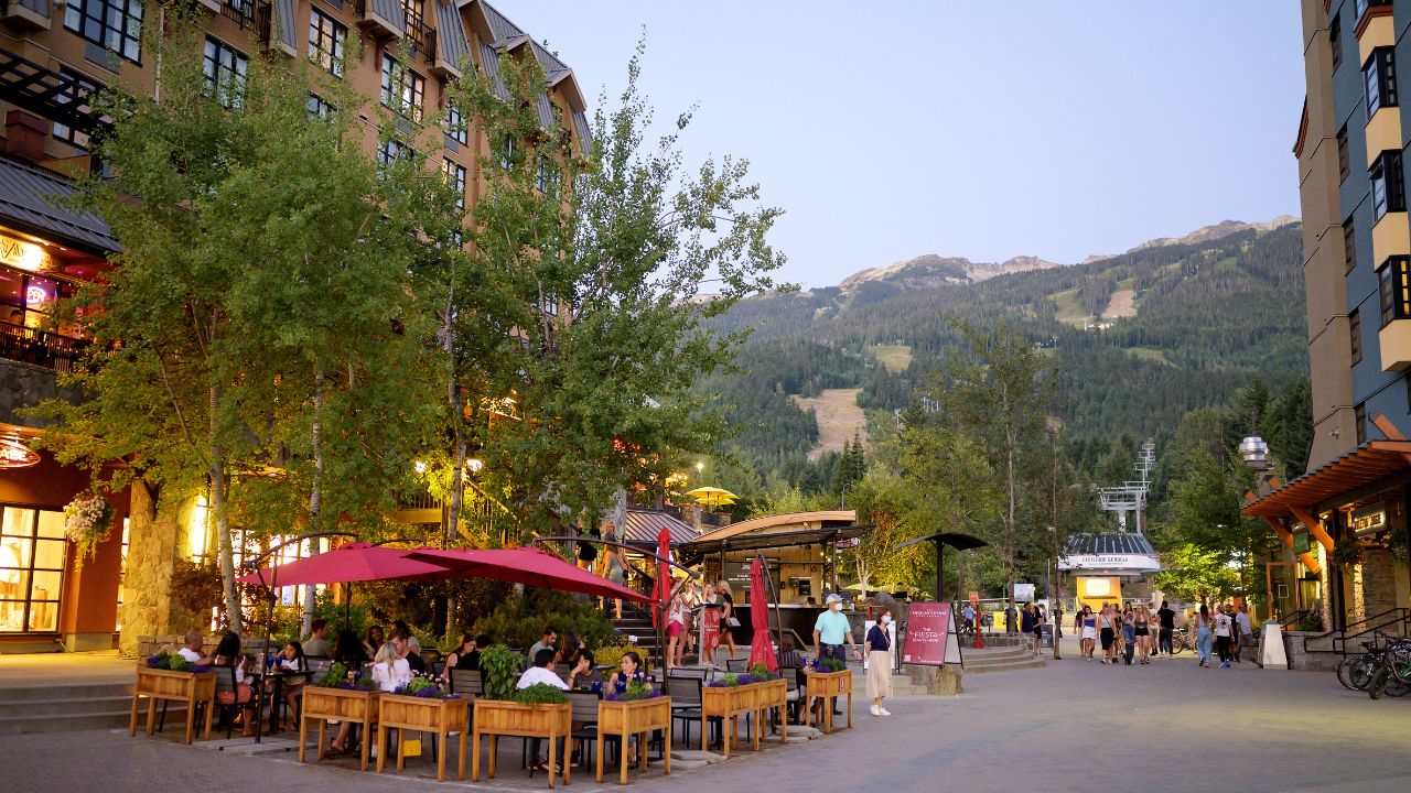 Whistler BC, Canada - July 30, 2021: Tourists on the patio of a local Whistler restaurant on a warm summer night.