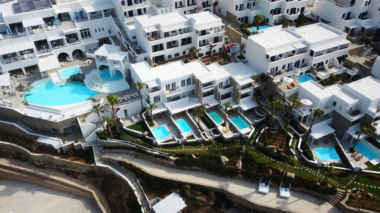 Mykonos, Cyclades / Greece - May 01 2018: Aerial drone photo of famous resort of Mykonos blue in iconic island of Mykonos, Cyclades, Greece