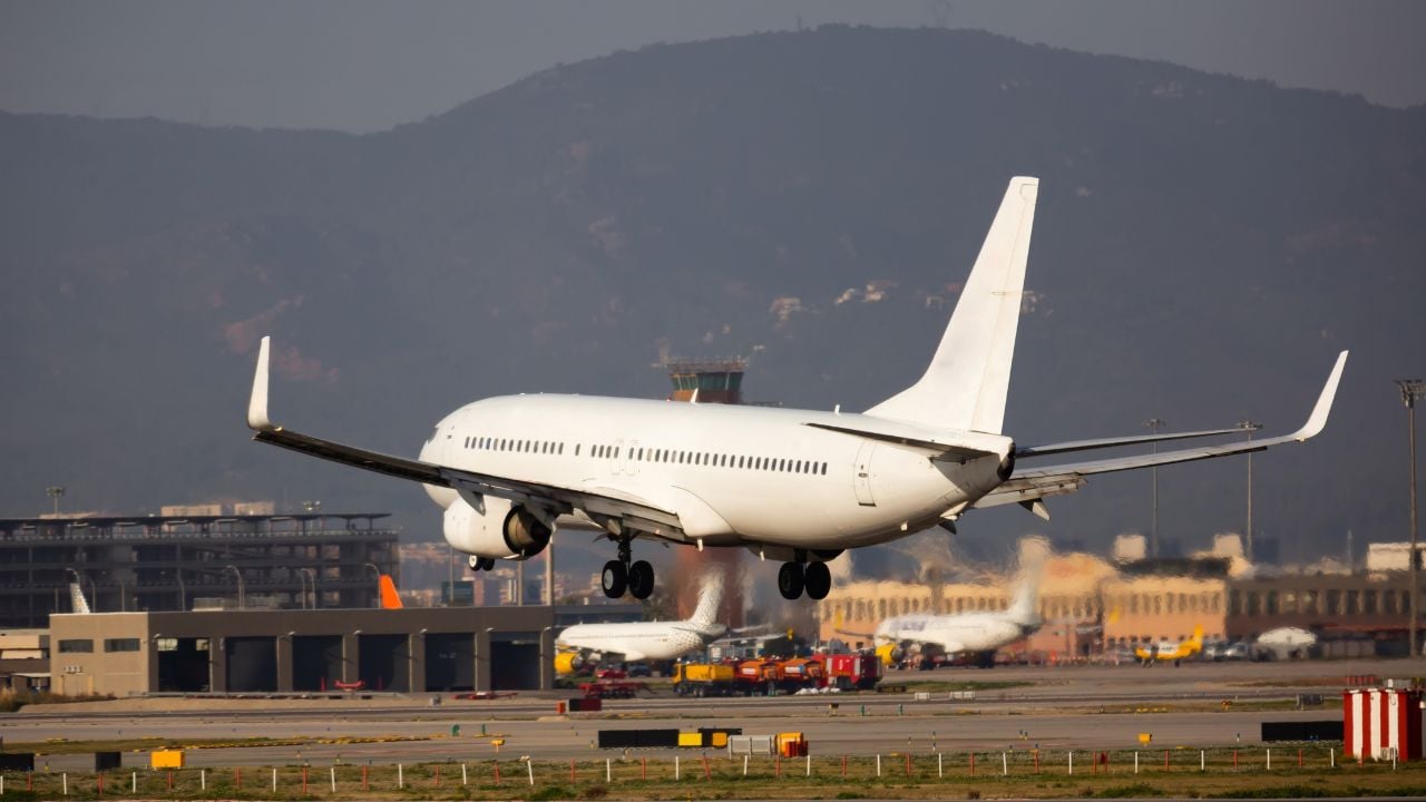View of passenger airplane landing in El Prat Airport, Barcelona