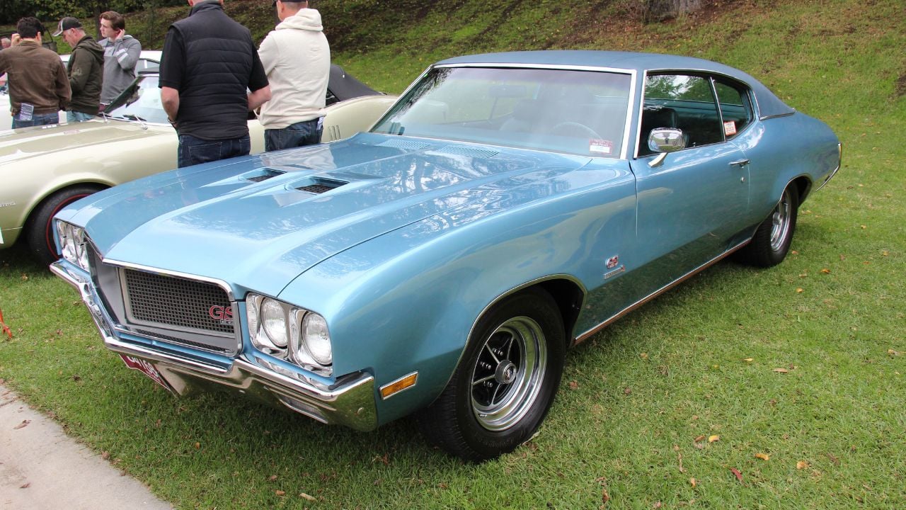Gulfstream Blue 1970 Buick GS 455 Stage 1 Coupe parked on grass at a car show