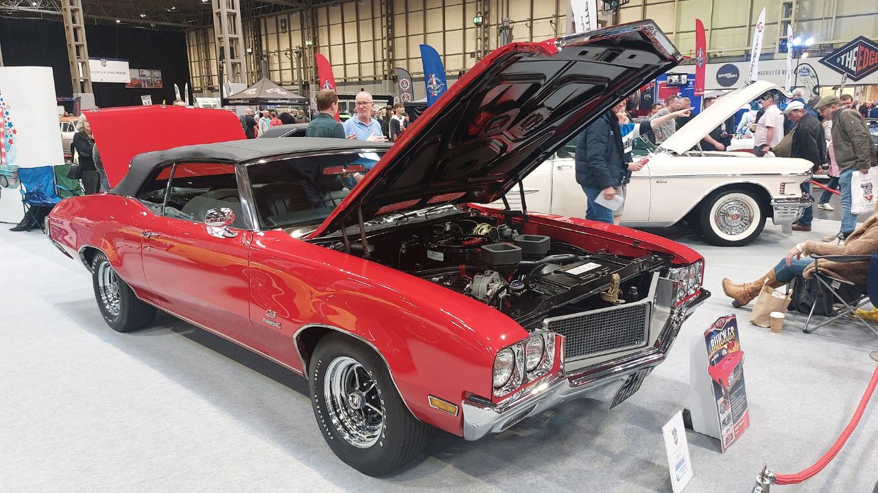 Red 1970 Buick GS 455 Convertible Parked at a car show with hood and trunk open