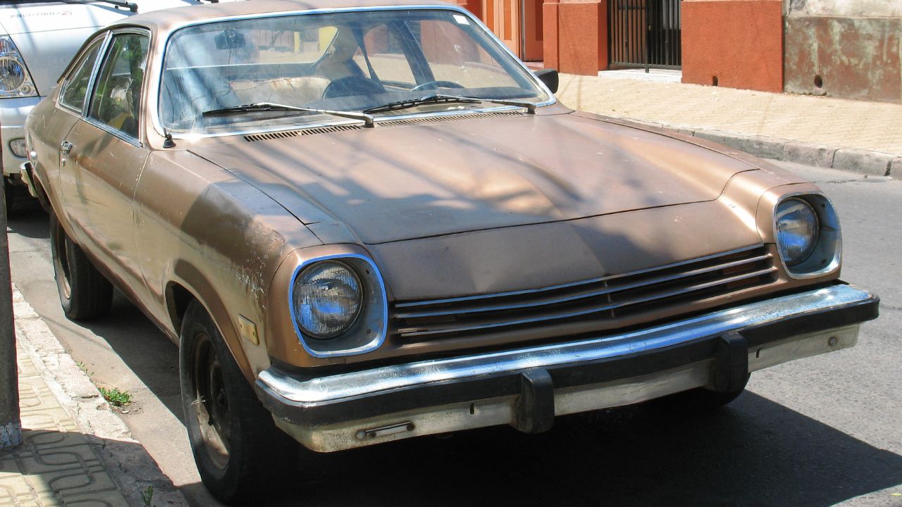 Metallic Brown 1976 Chevrolet Vega Fastback front 3/4 parked in the street
