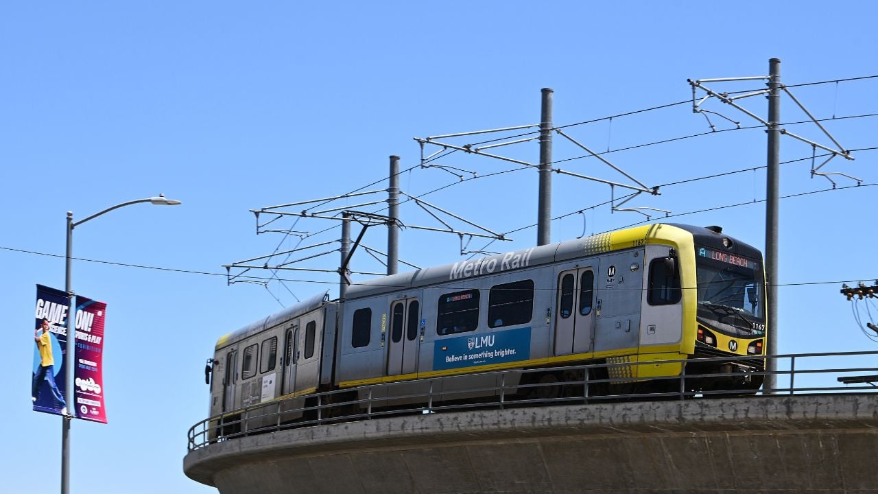 LOS ANGELES - 9 MAY 2025: Metro Rail train on overpass, an urban transit system serving Los Angeles consisting of four light rail lines and two rapid transit lines serving 102 stations.