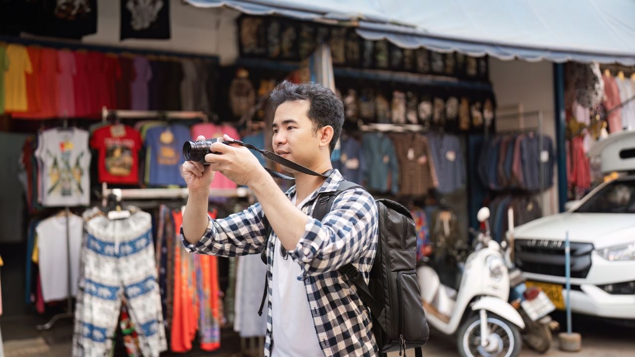 Traveler in a market: respectful, low-impact travel habits