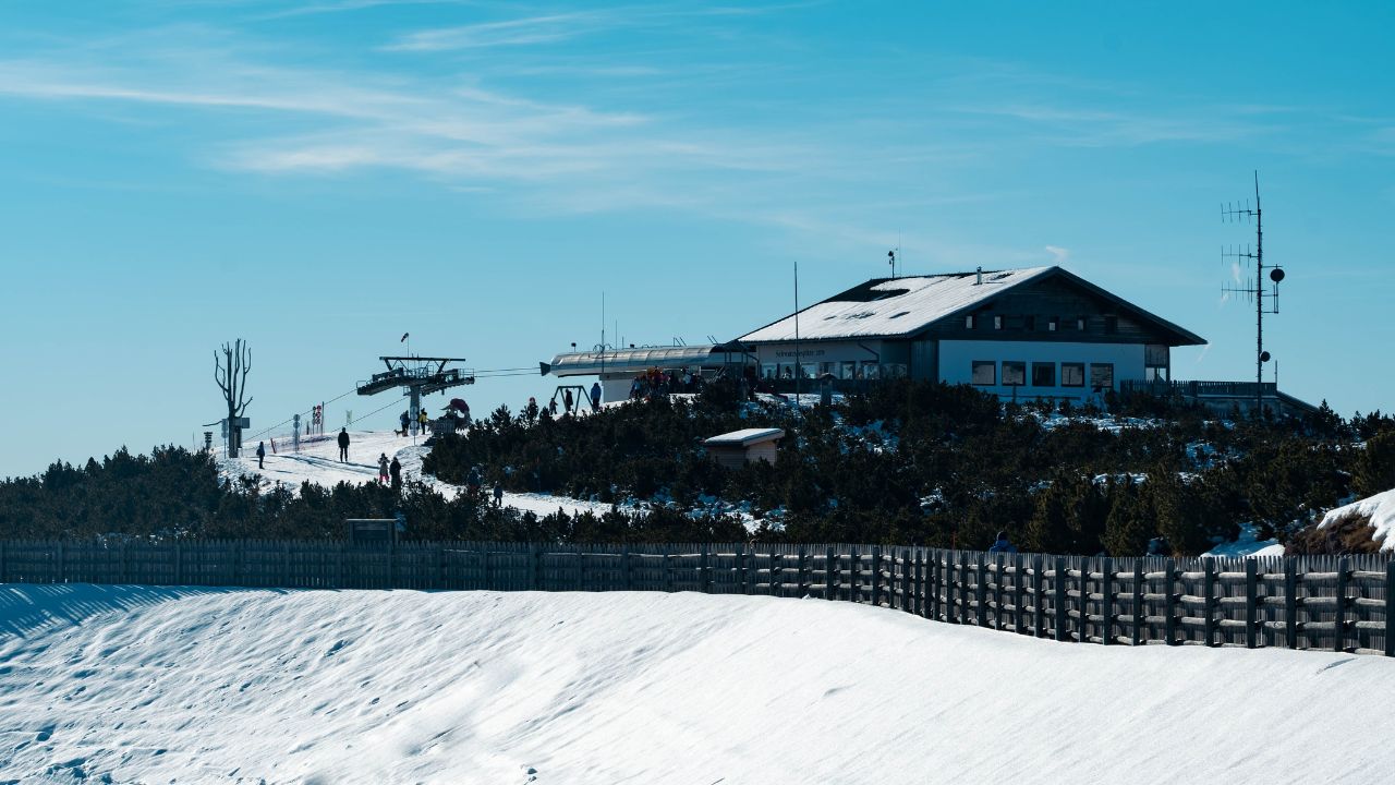 Renon, Italy - 05 02 2023: Large restaurant near the cable car station on the Corno del Renon. Hotel Schwarzseespitze, destination for visitors, skiers and hikers. Winter sports and outdoor life.
