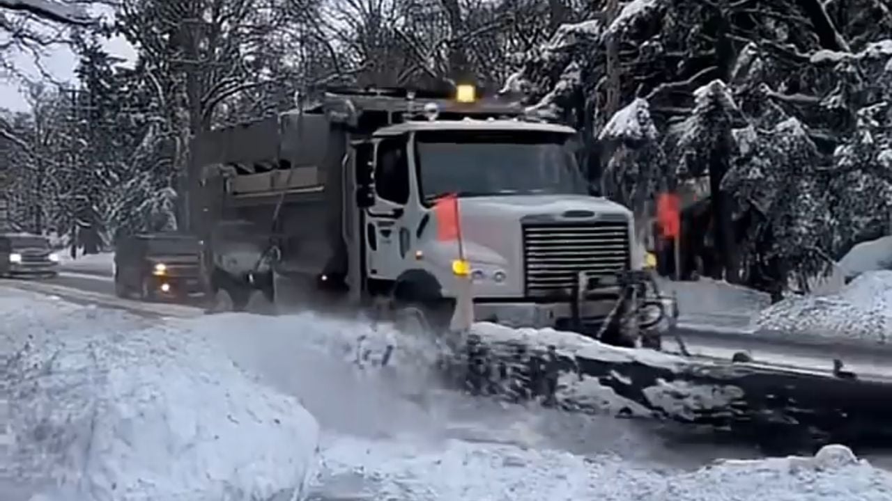 Snowplow driver caught burying parked cars in snow.