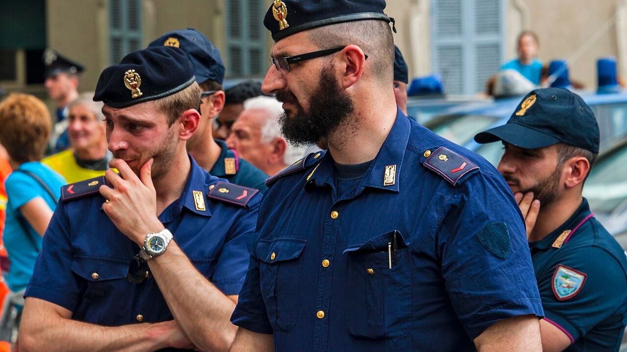 Italian police officers watching Wikimania 2016 closing ceremonies.