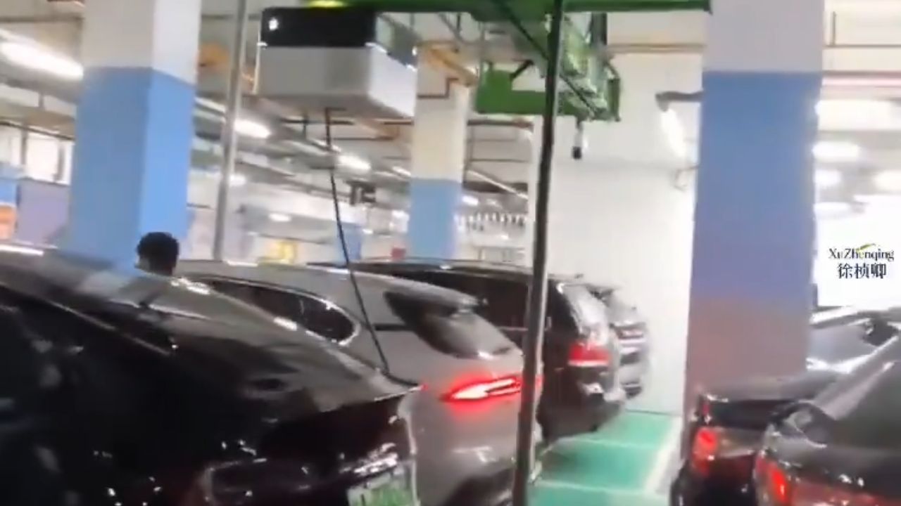 Ceiling-mounted EV charging robots in China.