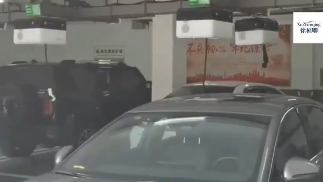 Ceiling-mounted EV charging robots in China.