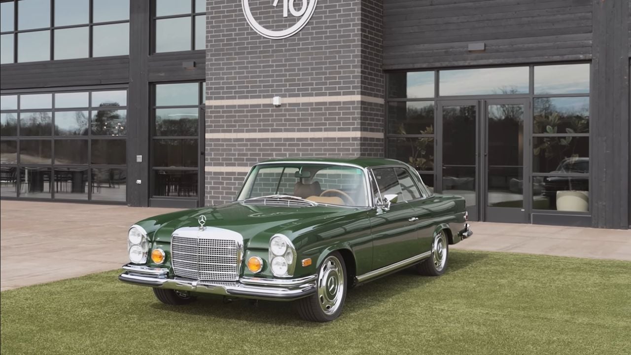 Front 3/4 view of a parked 1969 Mercedes 280SE Restomod By Retro Designs